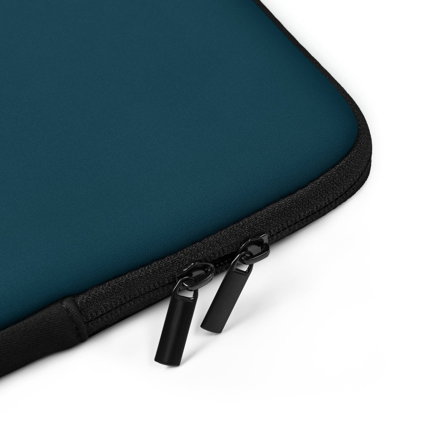 Close-up of a dark Teal laptop sleeve with a black zipper on a white background