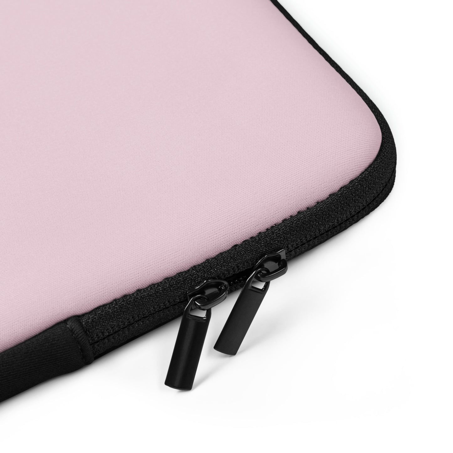 Close-up of a pink laptop case with a black zipper on a white background