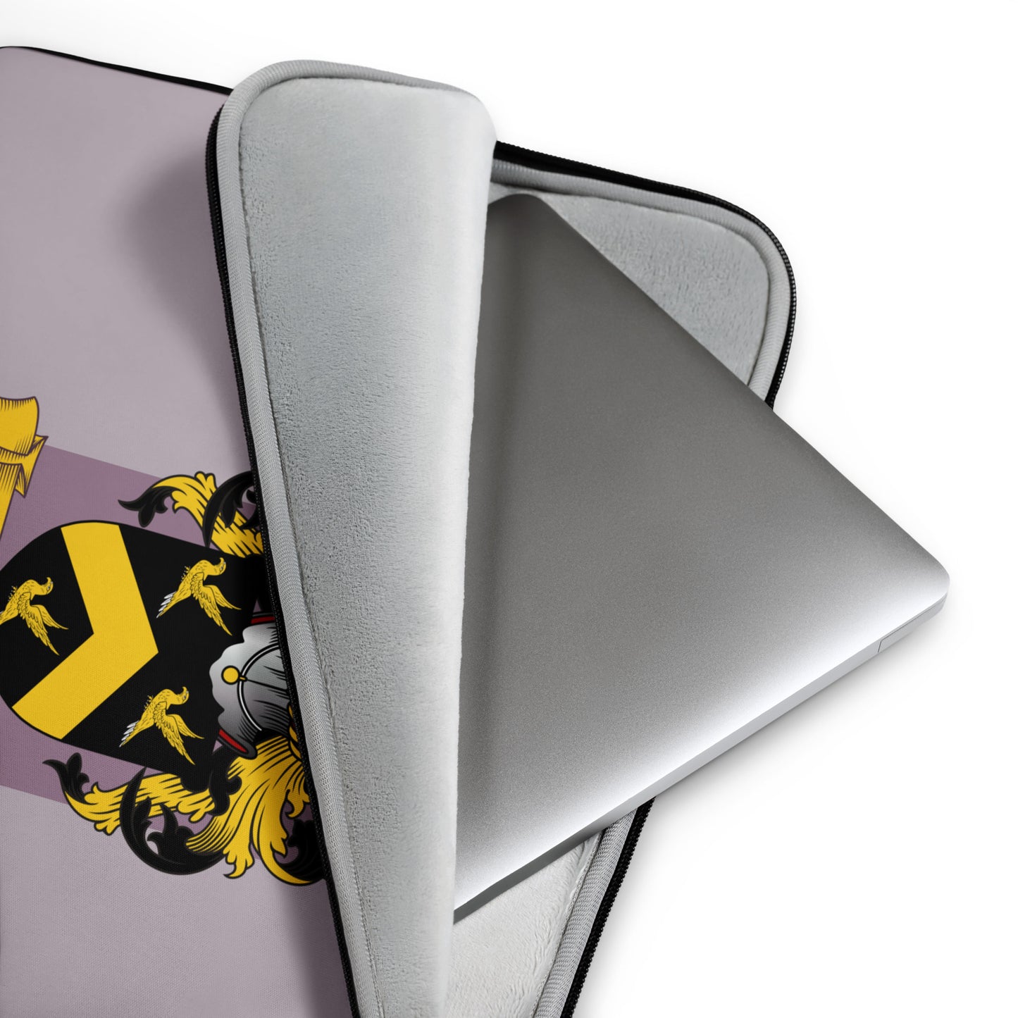 Mauve laptop with a personalized family crest on a white background