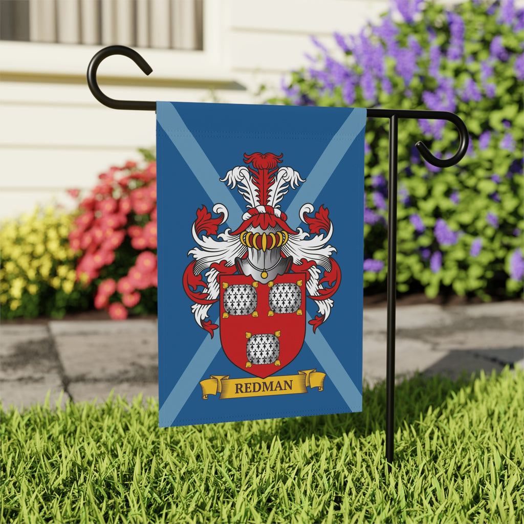 Family crest in a blue flag featuring a personalized last name  on a grassy area with flowers in the background