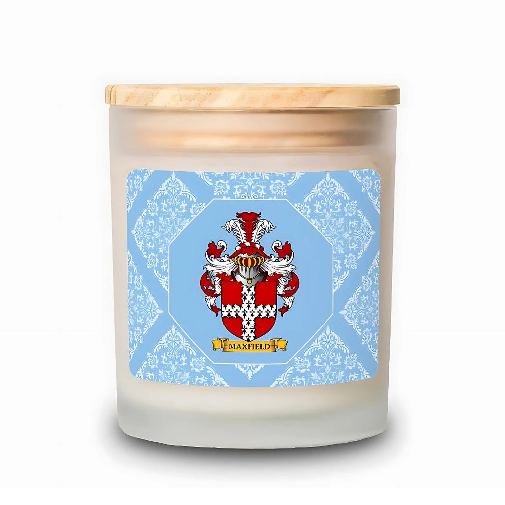 Candle with a pastel blue decorative label featuring a coat of arms on a white background