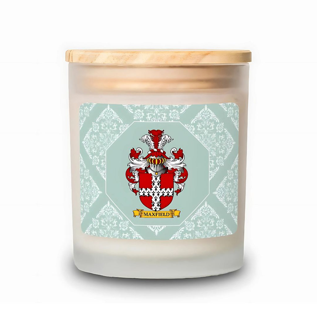 Scented candle with a personalized label featuring a coat of arms on a light green patterned background.