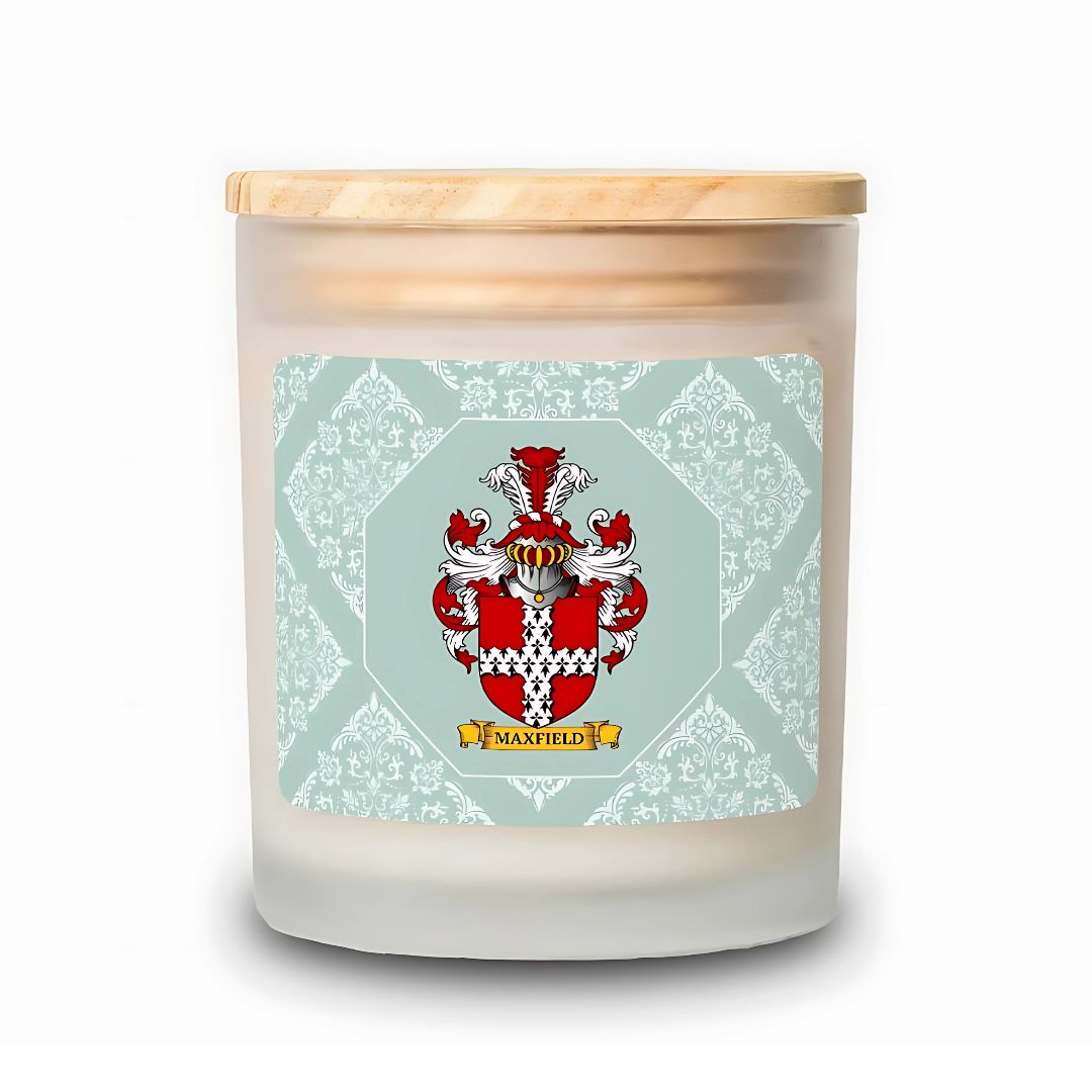 Scented candle with a personalized label featuring a coat of arms on a light green patterned background.