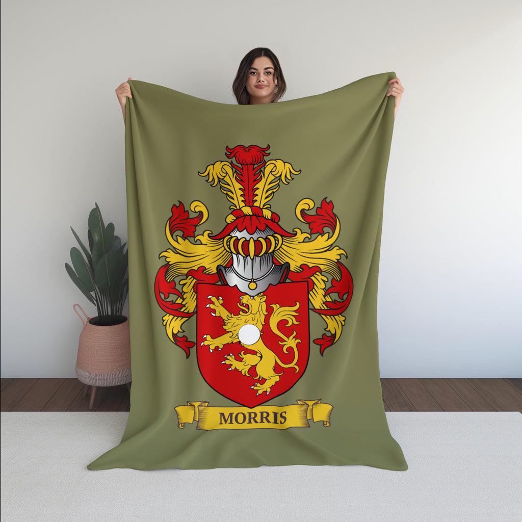 Woman holding a green 60x80 inches blanket with a Morris family crest design.