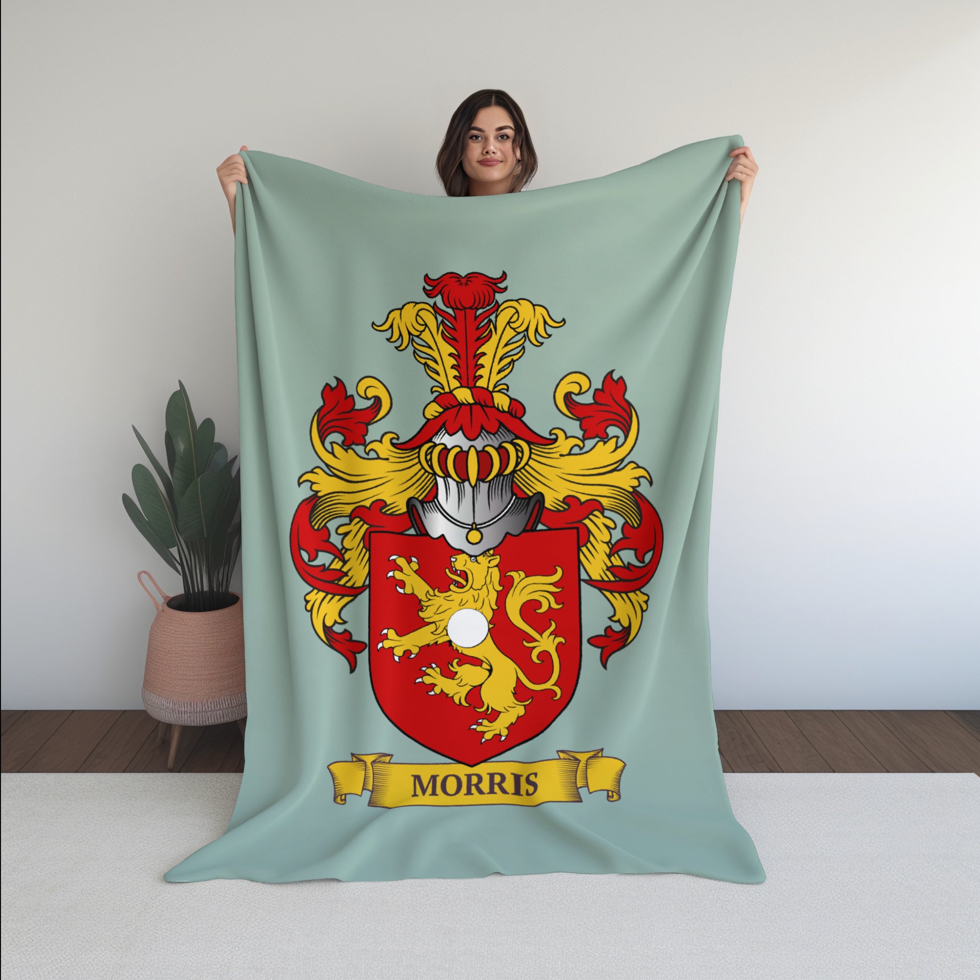 Young woman holding a Personalized blanket with a Morris family crest design against a white background