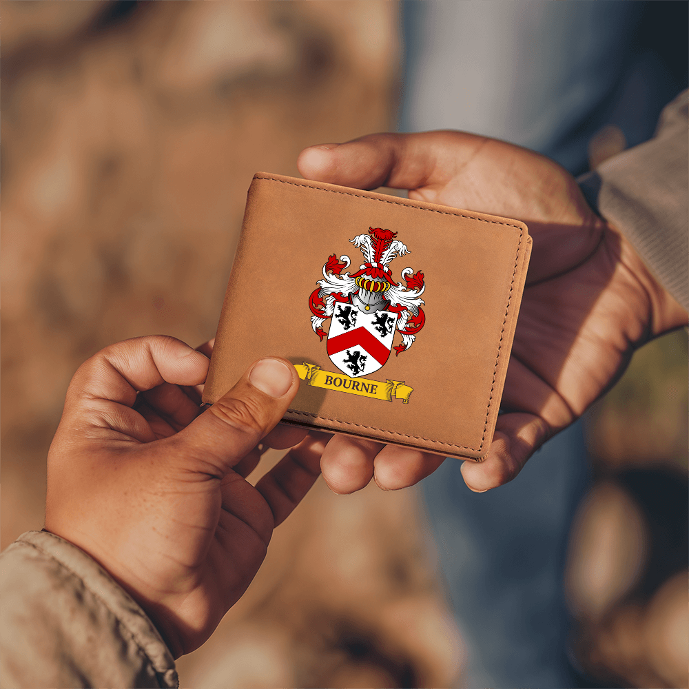 A pair of man's hands holding a personalized brown wallet with coat of arms design.
