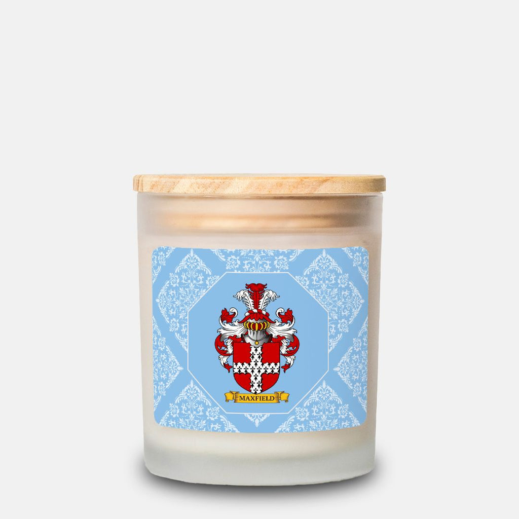 Customized scented candle with a decorative label featuring a coat of arms on a light blue background