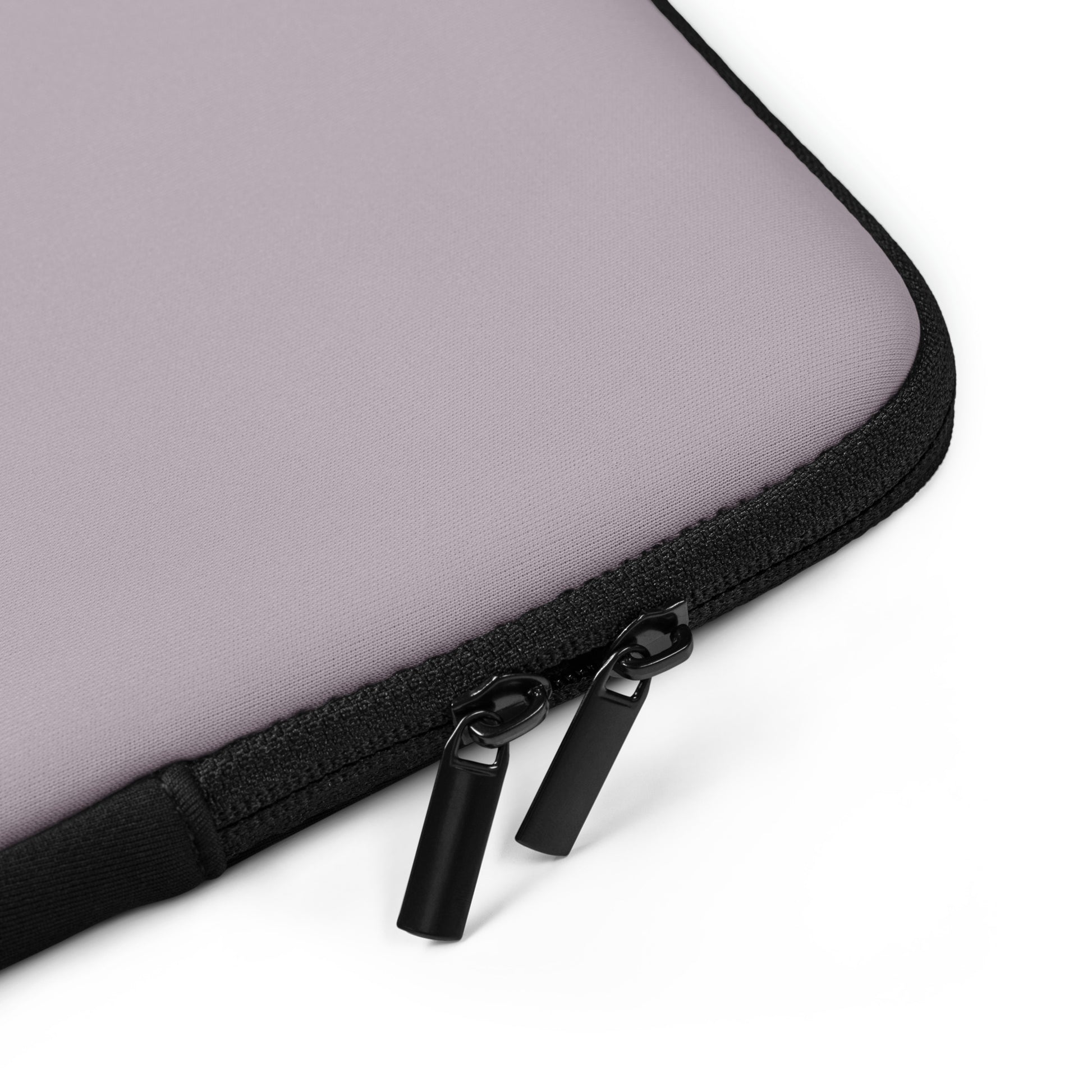 Close-up of a mauve laptop sleeve with black zipper on a white background