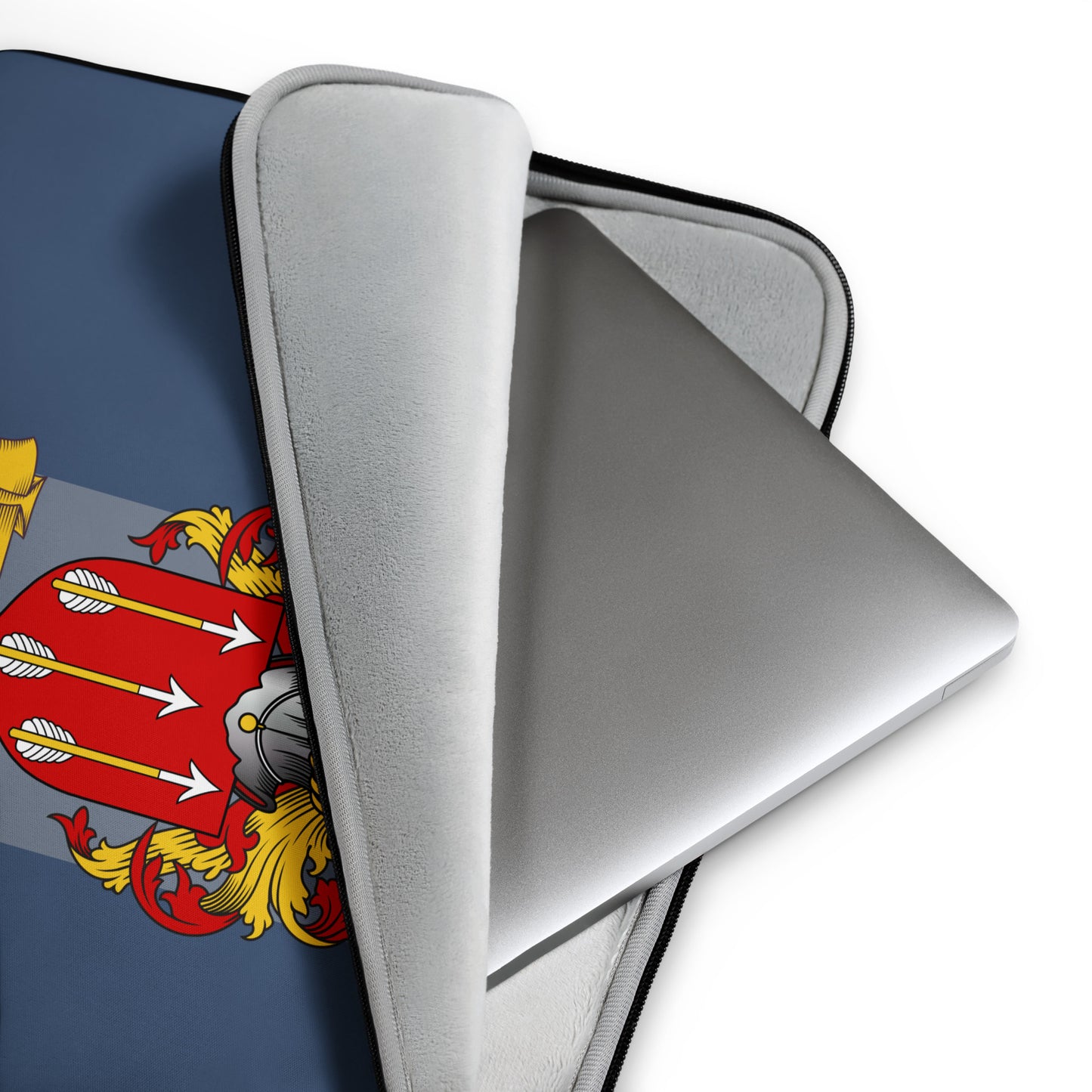 Laptop with a navy blue protective case featuring a coat of arms design.