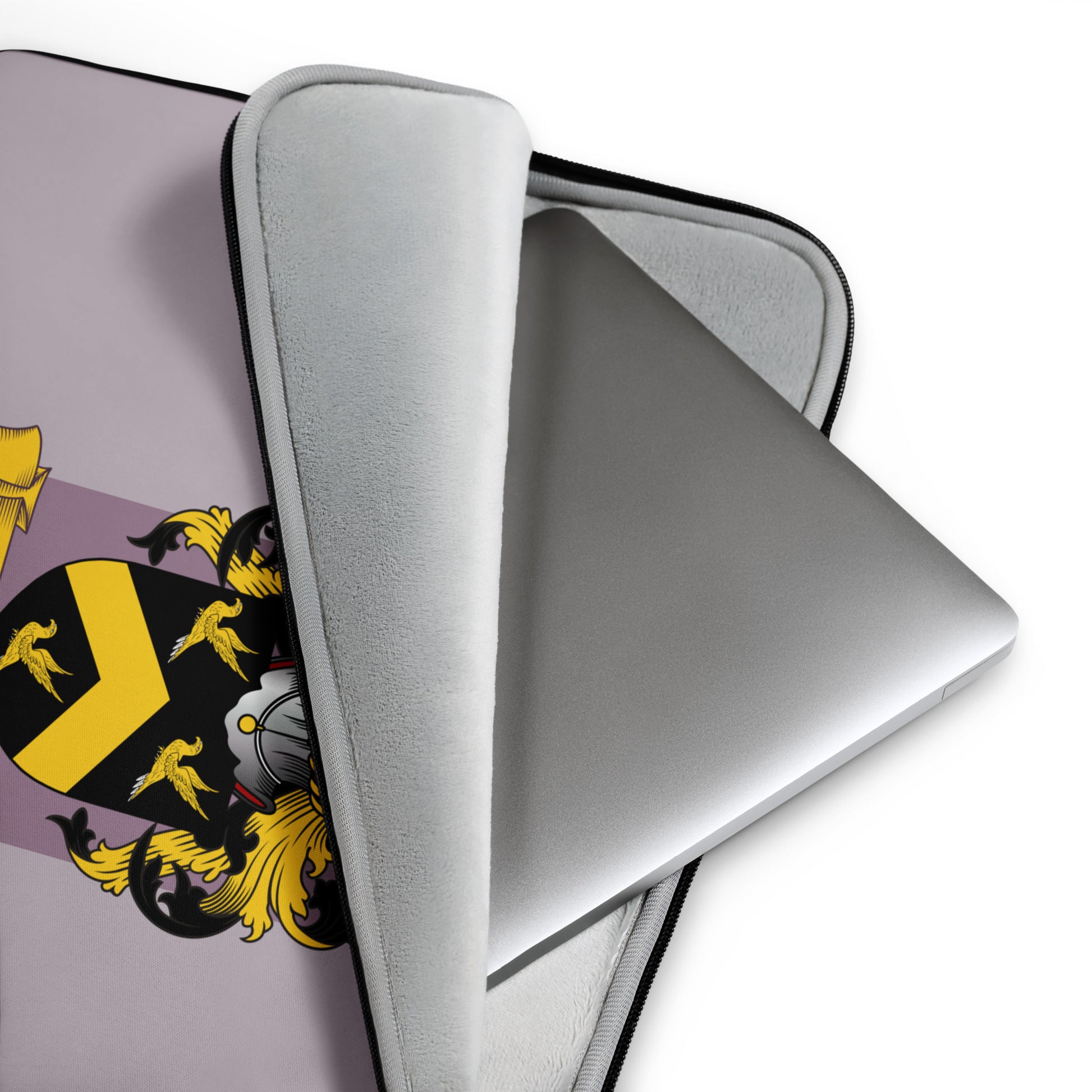 Mauve laptop with a personalized family crest on a white background