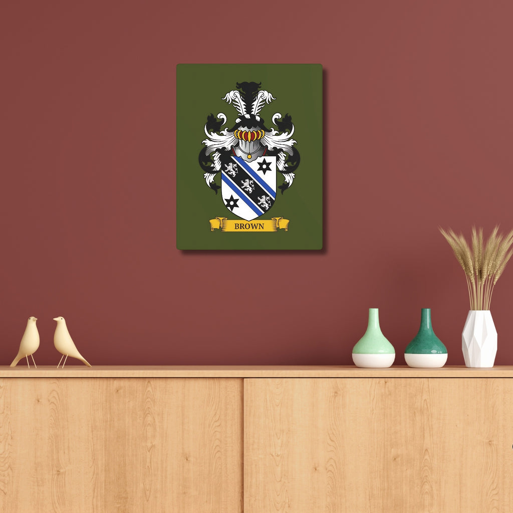 Personalized green metal print with a Family crest above a wooden shelf with decorative items.
